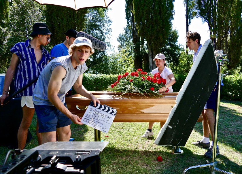 Elaine adjusting props on the set of "Drowned"
